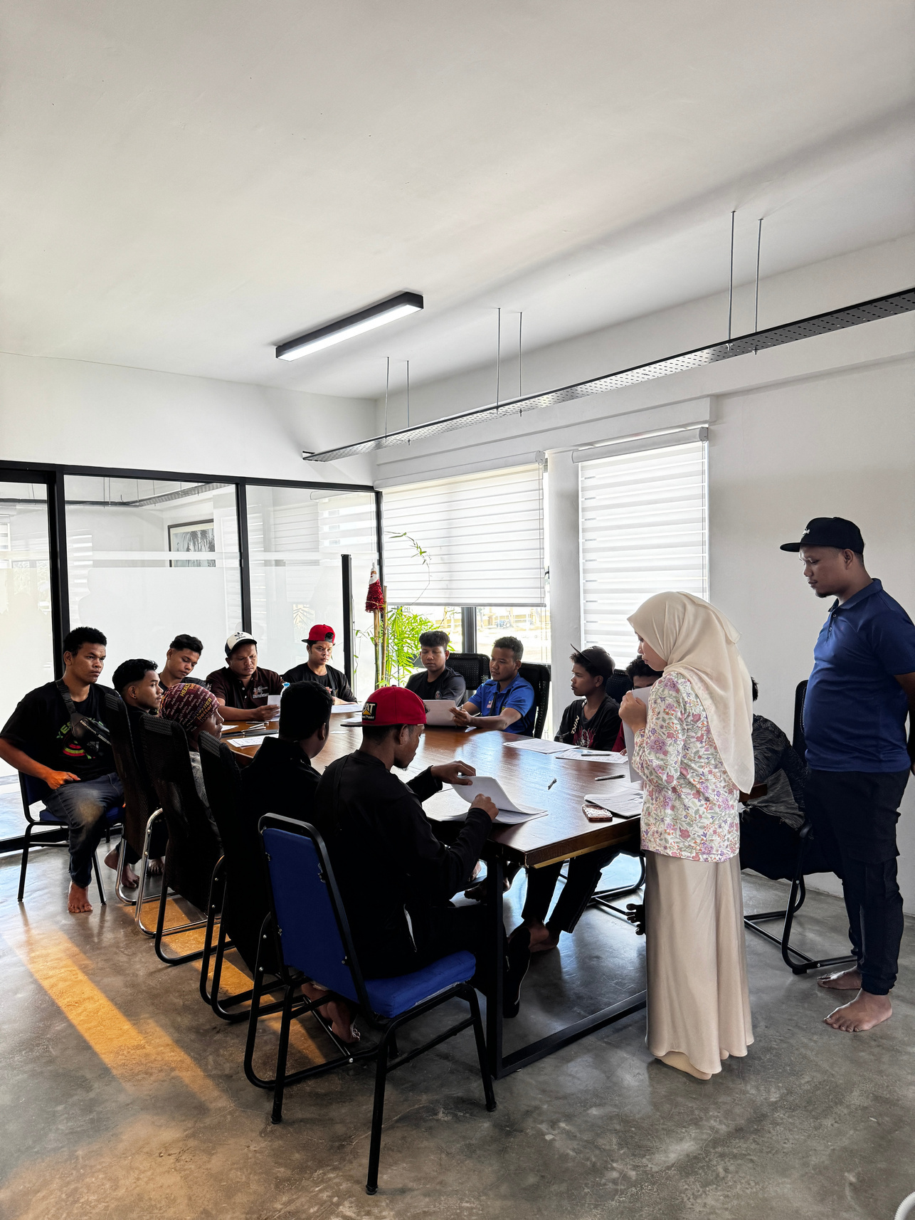 Recruitment candidates and coordinators meeting around a table
